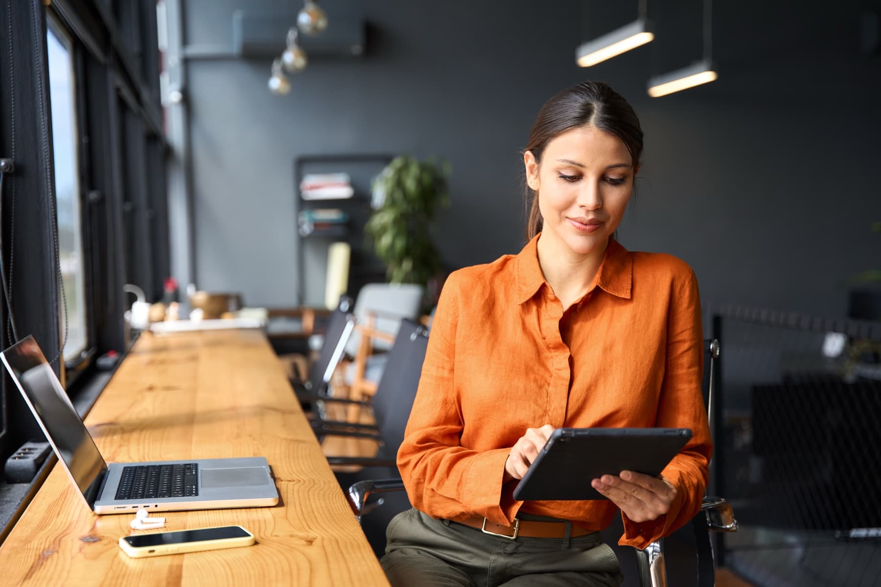 Accountant reviewing a client's tax documents on a tablet